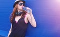 Young girl in sunglasses and hat. A teenager in a hat and glasse Royalty Free Stock Photo