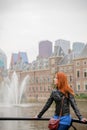 Young girl in sunglasses standing near fountain Royalty Free Stock Photo