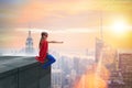 The young girl in superhero costume overlooking the city Royalty Free Stock Photo