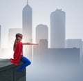 Young girl in superhero costume overlooking the city Royalty Free Stock Photo