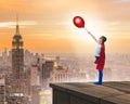 Young girl in superhero costume overlooking the city Royalty Free Stock Photo