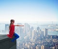 Young girl in superhero costume overlooking the city Royalty Free Stock Photo