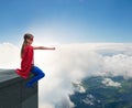 Young girl in superhero costume overlooking the city Royalty Free Stock Photo