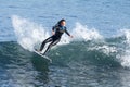 Young Girl Surfing a Wave in California