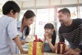 Young girl is surprised by a birthday party and celebrate with family together