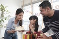 Young girl is surprised by a birthday party and celebrate with family together