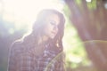 A young girl surrounded by sunlight