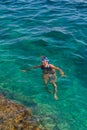 Young girl swiming in the sea Royalty Free Stock Photo