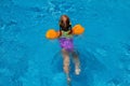 Young girl swiming in the pool. holiday idyllic.. Royalty Free Stock Photo