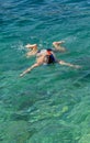 Young girl swiming in the sea Royalty Free Stock Photo