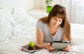 Woman with tablet is working or learning