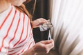 Female hands hold one tablet and thermometer close-up Royalty Free Stock Photo