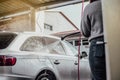 A young girl taking care of her car Royalty Free Stock Photo