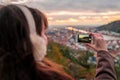 Young girl taking a photo on the iPhone Royalty Free Stock Photo