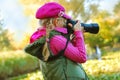 Young girl taking photos in autumn park Royalty Free Stock Photo