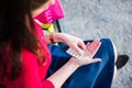 Young girl is taking a pill in the park Royalty Free Stock Photo