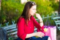 Young girl is taking a pill in the park Royalty Free Stock Photo