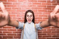 Young girl taking selfie smart phone/photo camera. Royalty Free Stock Photo