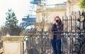 Young girl taking a street photo in Paris