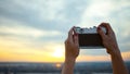 Young girl taking sunset photo in NYC