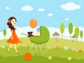 Young girl taking a walk with a baby in a pram Royalty Free Stock Photo