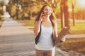 Young girl talking on a cell phone in the park Royalty Free Stock Photo