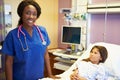 Young Girl Talking To Female Nurse In Hospital Room Royalty Free Stock Photo