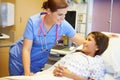 Young Girl Talking To Female Nurse In Hospital Room Royalty Free Stock Photo