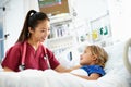 Young Girl Talking To Female Nurse In Intensive Care Unit Royalty Free Stock Photo
