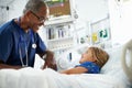 Young Girl Talking To Male Nurse In Intensive Care Unit Royalty Free Stock Photo