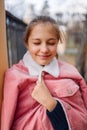 Young girl teenager with shut eyes. Teen standing in park smiling and thinking Royalty Free Stock Photo