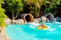 Young girl or teenager in the water slides of a park or a resort Royalty Free Stock Photo