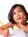 Young girl thinking and writing Royalty Free Stock Photo