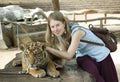 Young girl with a tiger Royalty Free Stock Photo