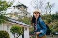 Young girl tourist face camera smiling holding slr camera. professional photographer always travel with her digicam. lady traveler