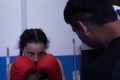 Young girl training boxing in a gym with her trainer Royalty Free Stock Photo