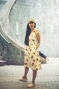 Young girl traveler sitting on circle stairs of a spiral staircase of an underground crossing in tunnel at Fort Canning Park, Sin Royalty Free Stock Photo