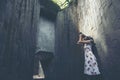 Young girl traveler sitting on circle stairs of a spiral staircase of an underground crossing in tunnel at Fort Canning Park, Sin Royalty Free Stock Photo