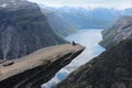 Young girl on the Troll's tongue (norw. Trolltunga). Royalty Free Stock Photo