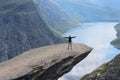 Young girl on the Troll's tongue (norw. Trolltunga). Royalty Free Stock Photo