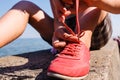 Young girl tying shoelace. Royalty Free Stock Photo