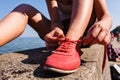 Young girl tying shoelace. Royalty Free Stock Photo