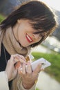 Young girl typing on phone