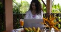Young Girl Use Laptopn Computer On Summer Terrace During Breakfast, Beautiful WomanTypung Keyboard While Drinking Juice