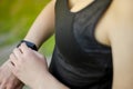 A young girl uses a fitness tracker. Smartwatch. Royalty Free Stock Photo