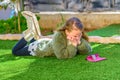 Young Girl Using Cellphone Outdoor.