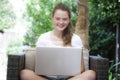 A young girl using her laptop outside Royalty Free Stock Photo