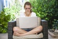 A young girl using her laptop outside Royalty Free Stock Photo