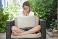 A young girl using her laptop outside Royalty Free Stock Photo