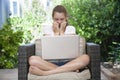 A young girl using her laptop outside Royalty Free Stock Photo